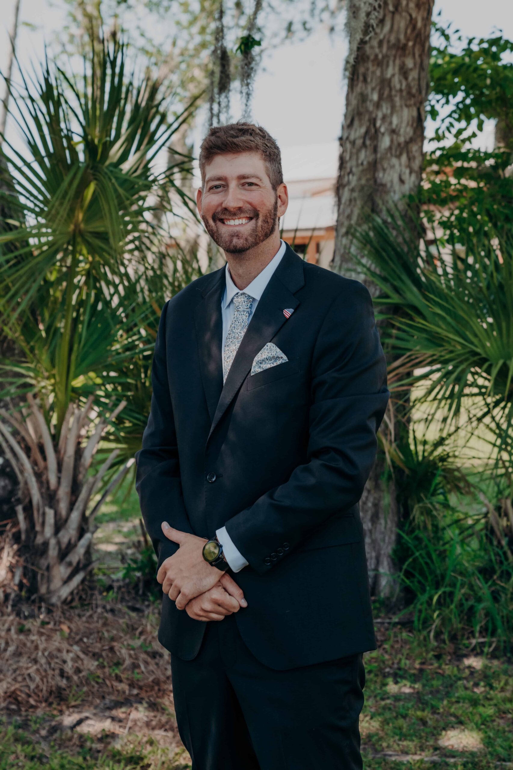 Hidden Acres wedding groom Sean portrait among palm trees Palmetto Florida