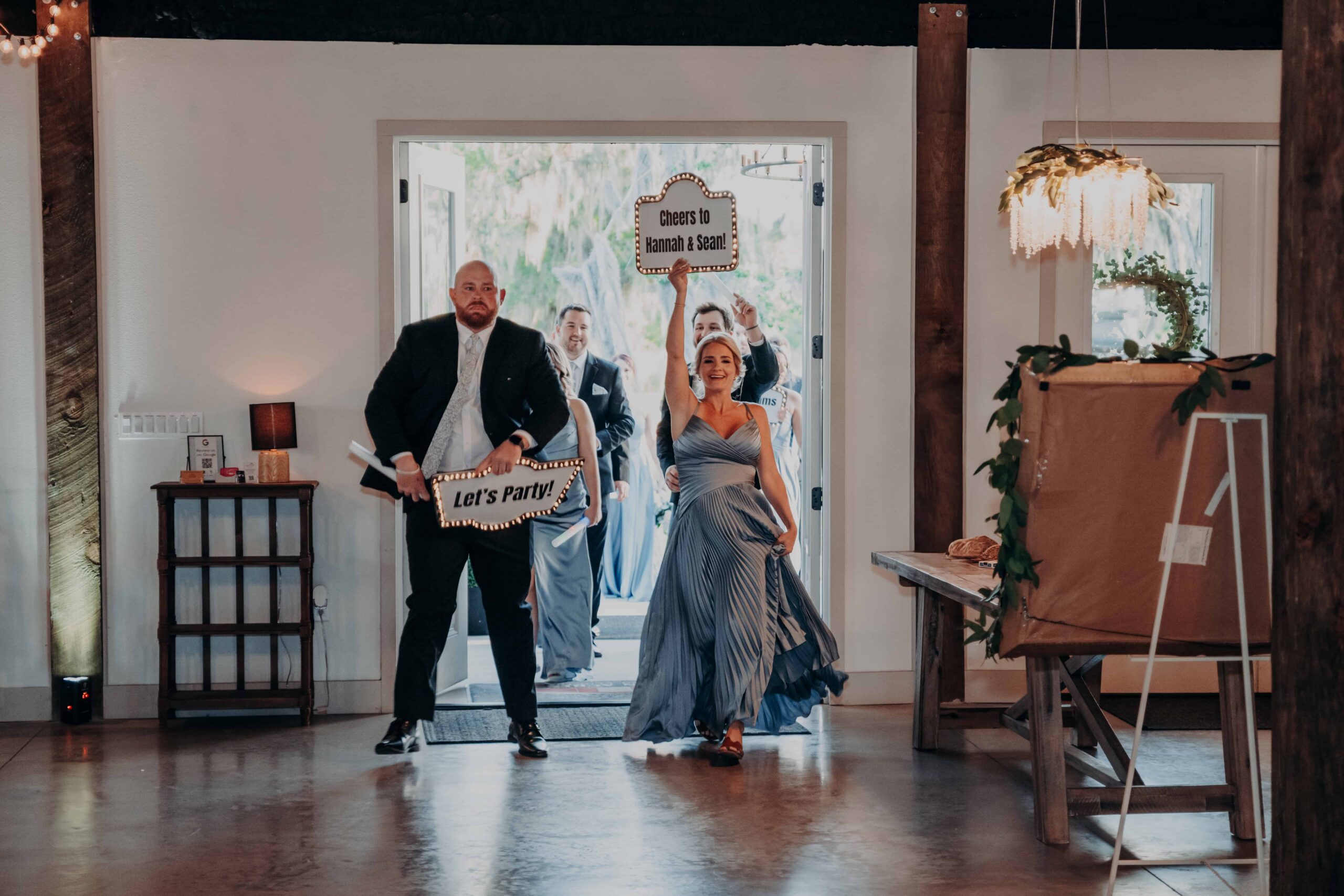 Hidden Acres wedding party entrance reception lets party signs