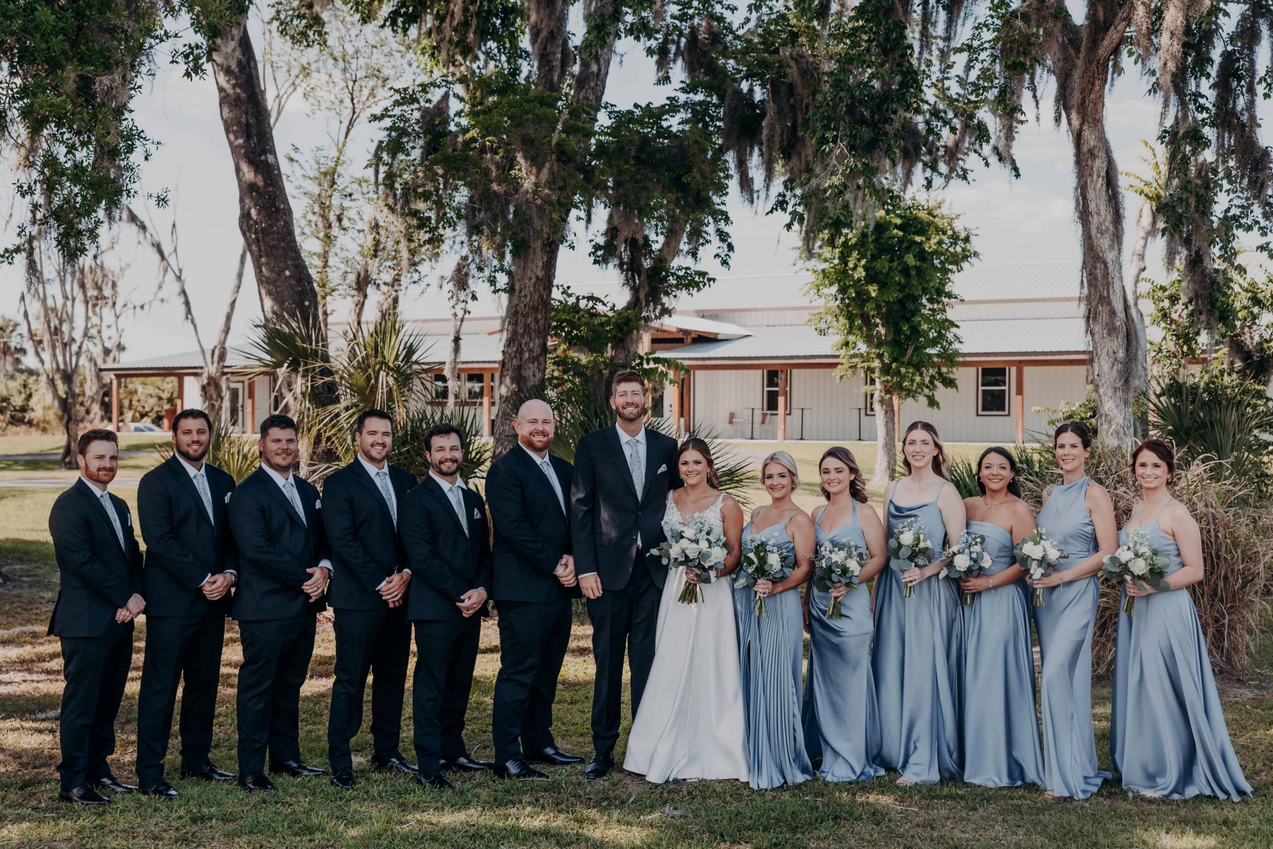 Hidden Acres wedding party full group photo in front of venue Parrish Florida