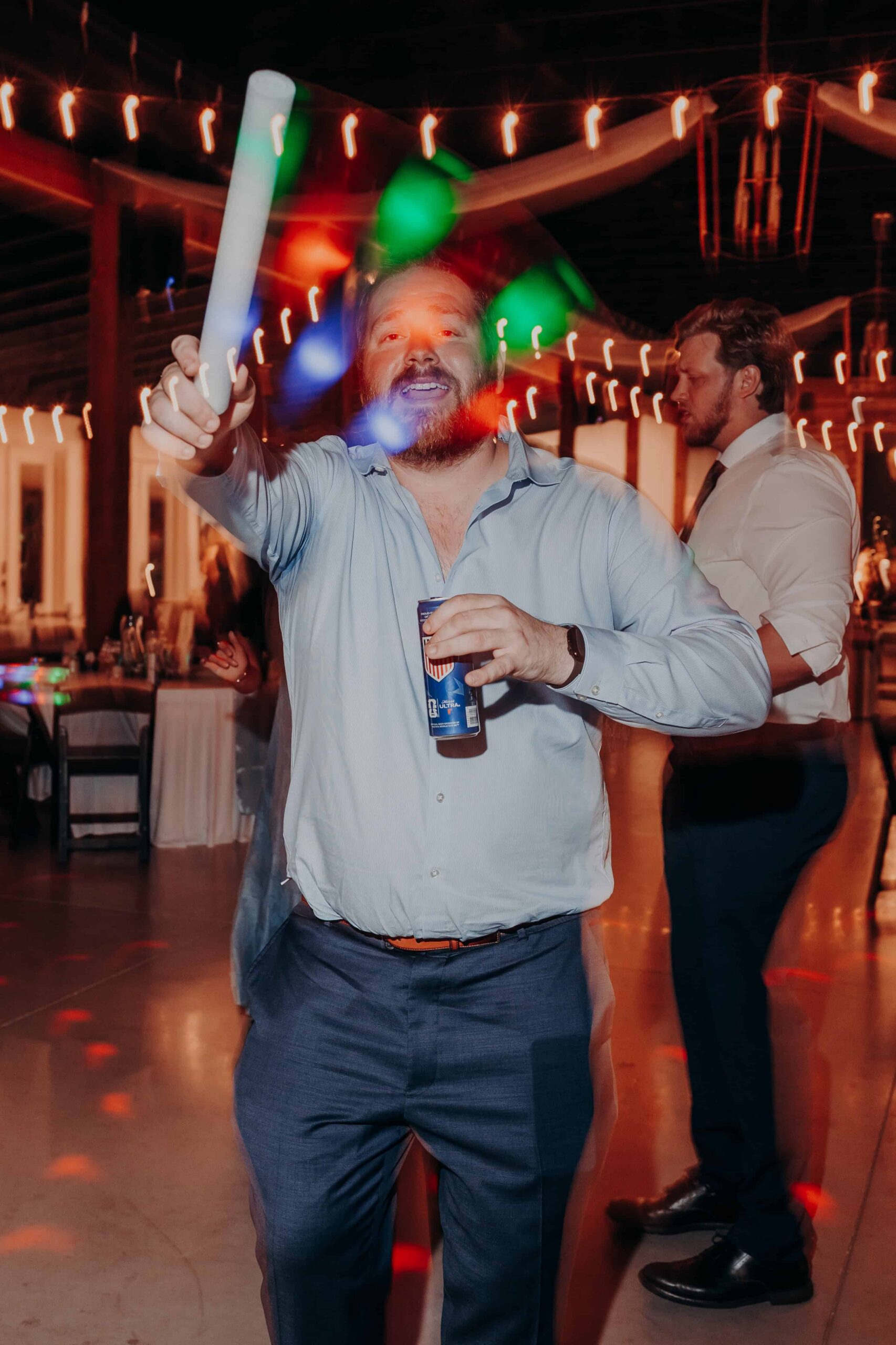 Hidden Acres wedding reception guests dancing with glow sticks