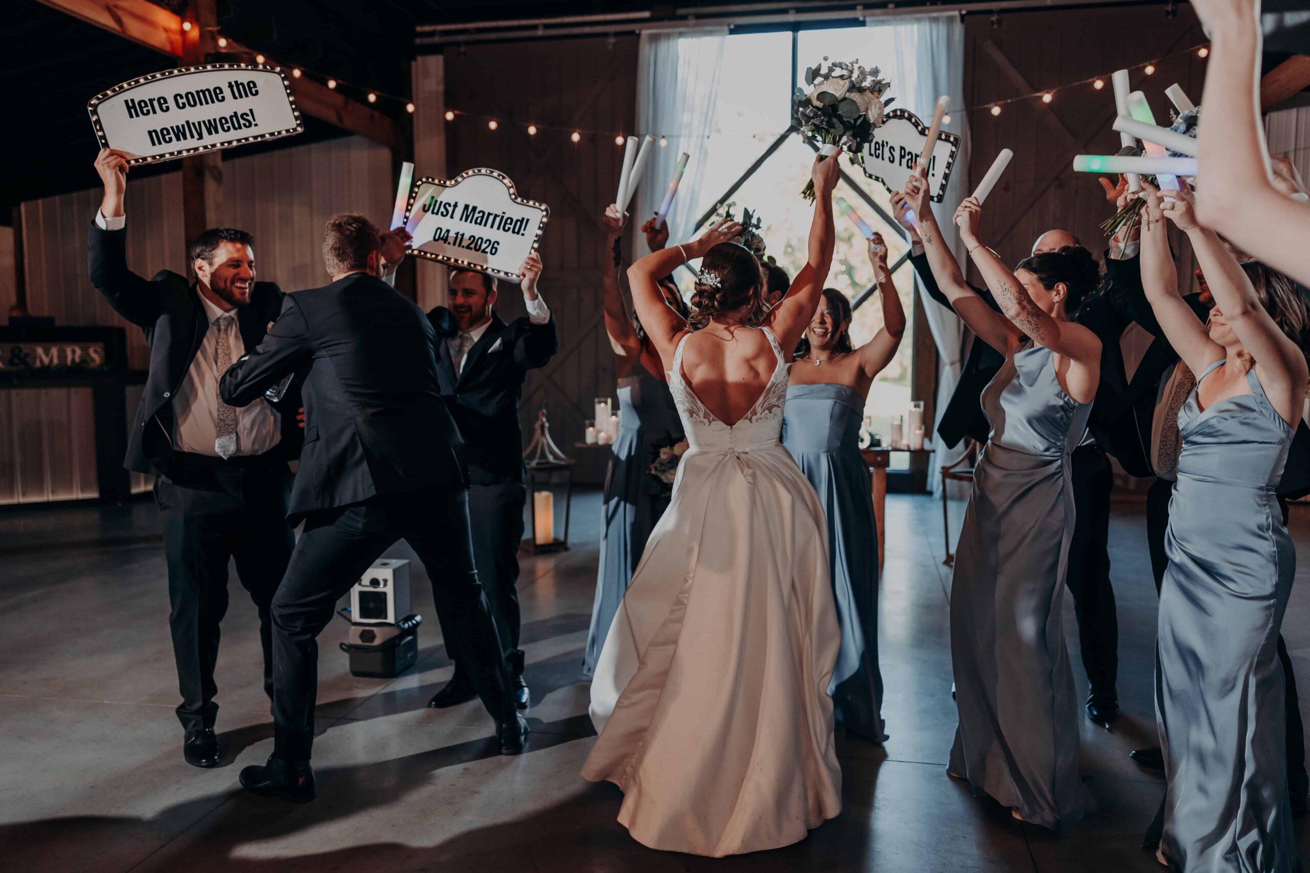 Hidden Acres wedding reception entrance just married signs glow sticks