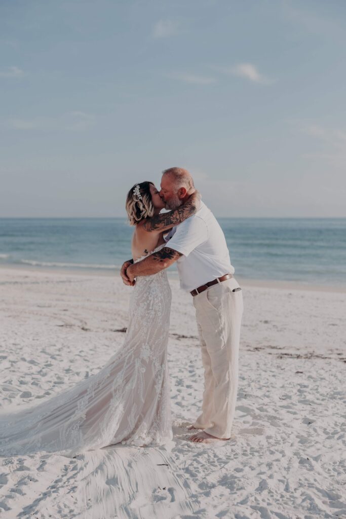 Intimate moment between Sarah and Jasen on Siesta Key beach right after their ceremony
