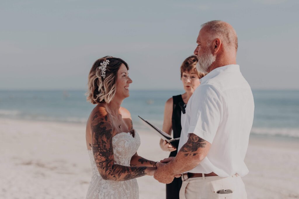 Intimate Siesta Key beach elopement ceremony with white sand and Gulf of Mexico backdrop