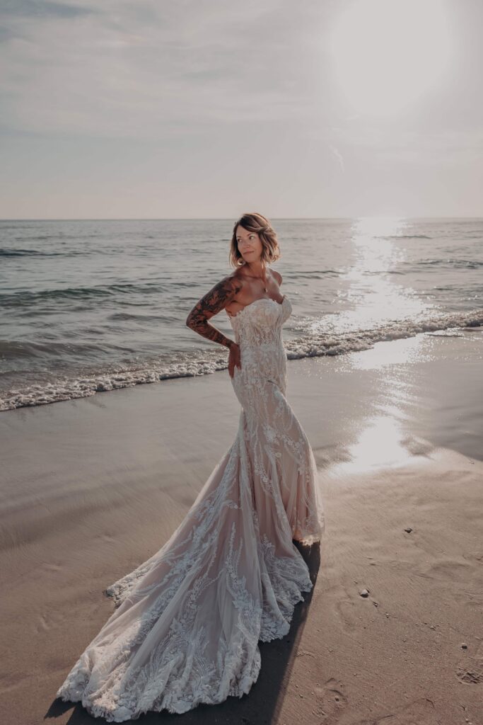 Sarah and Jasen twirling and laughing together during golden hour beach elopement portraits