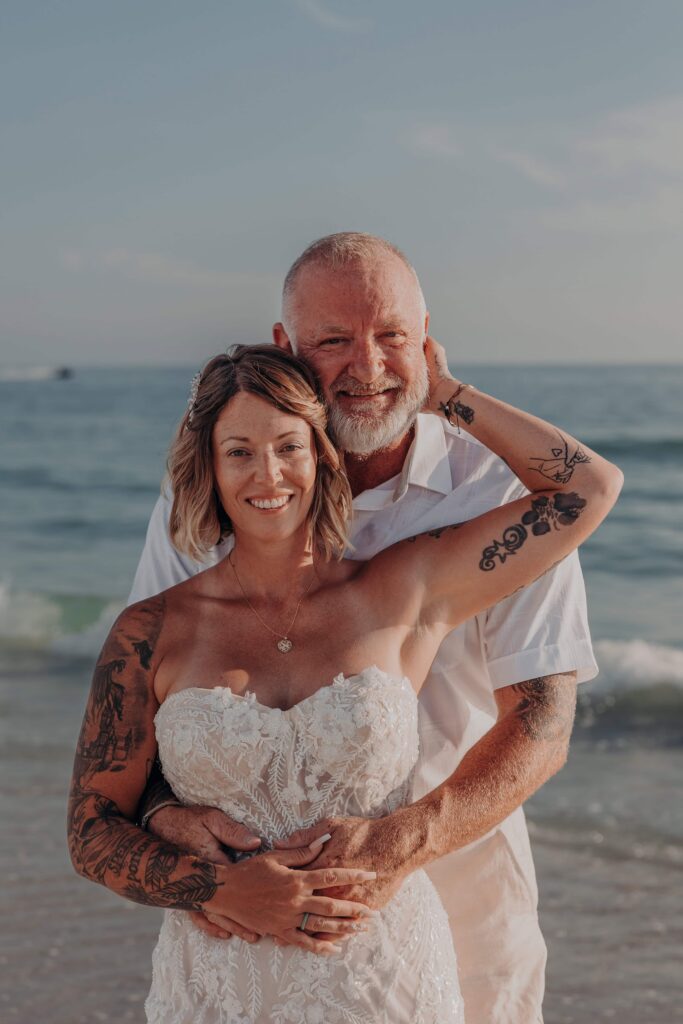 Soft warm light on Siesta Key beach during Sarah and Jasen elopement portrait session