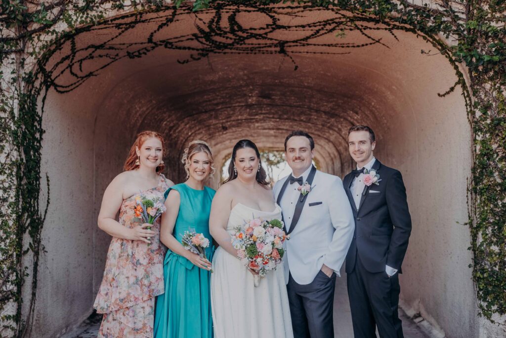 Wedding party portrait in ivy-covered tunnel at Lakewood Ranch Golf and Country Club Sarasota FL
