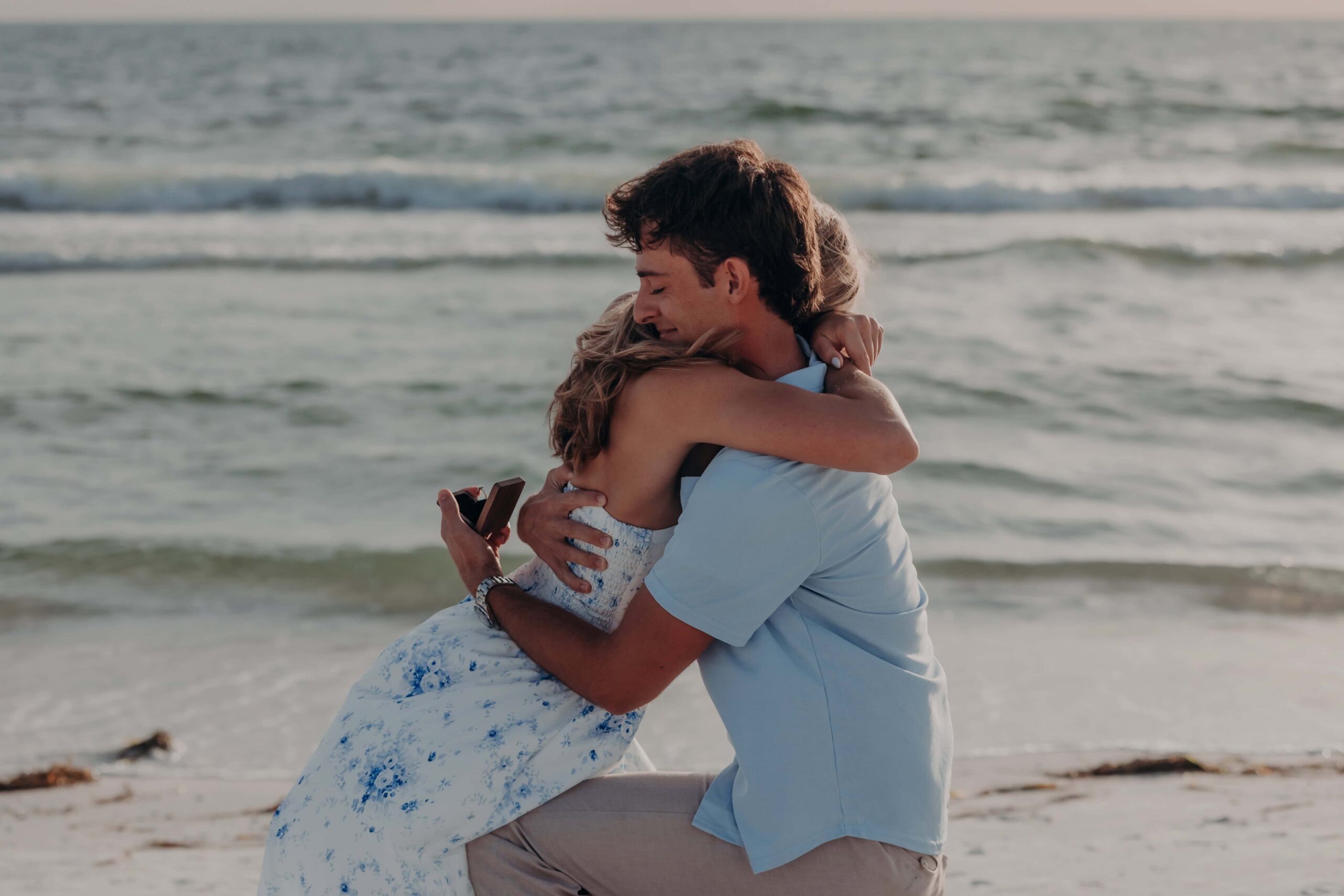 Quinten and Suzanna embracing right after their Lido Beach proposal