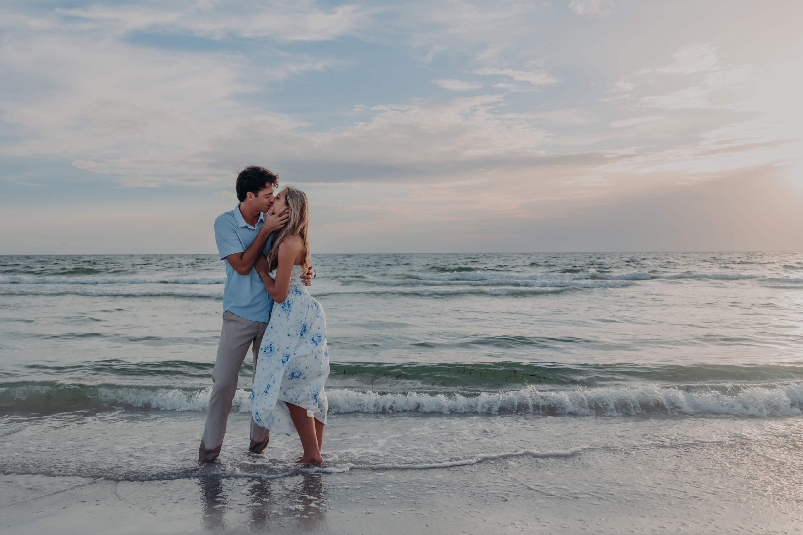 Quinten and Suzanna kissing in the surf on Lido Beach, Sarasota