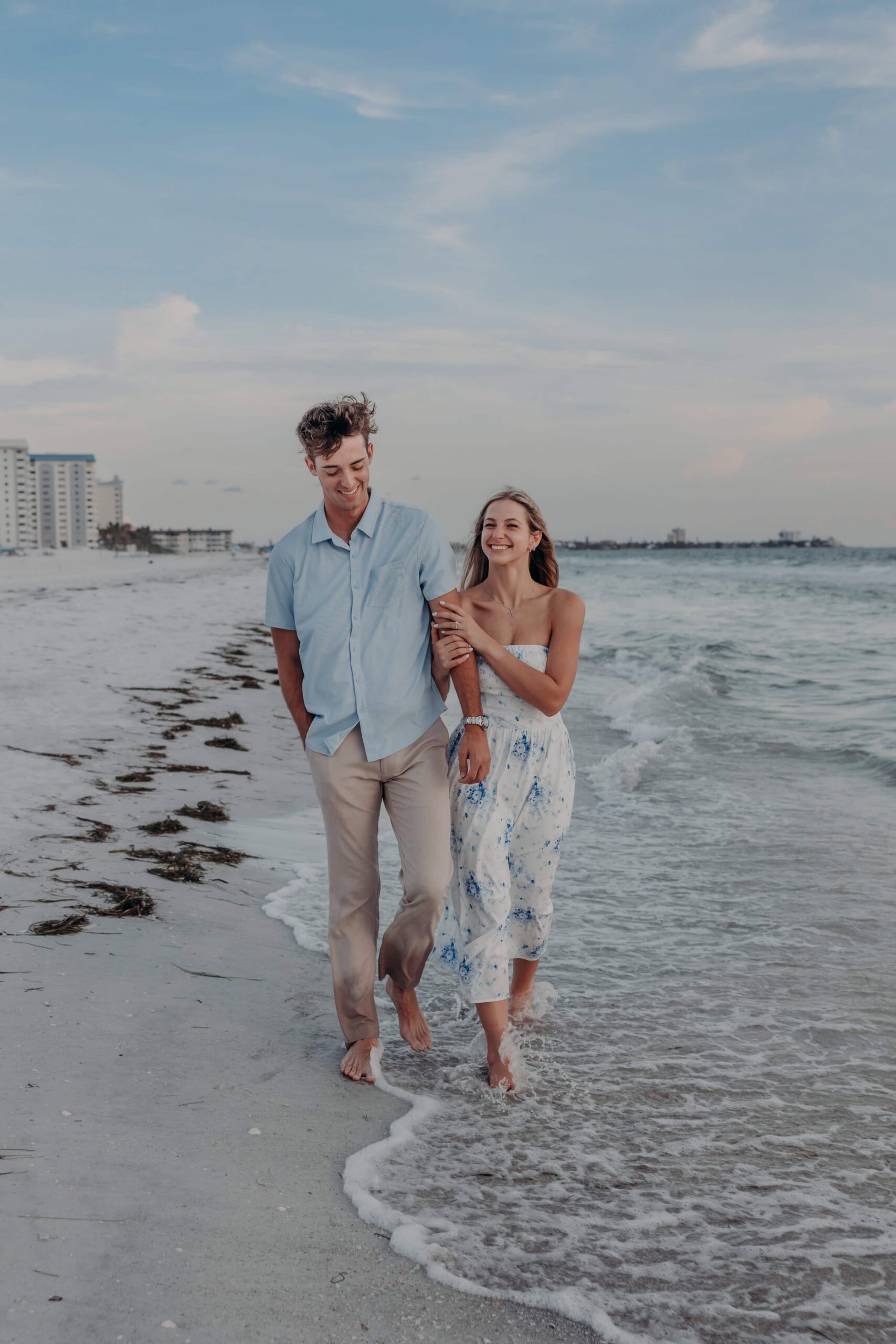Quinten and Suzanna walking along Lido Beach after the proposal, heading back to the resort