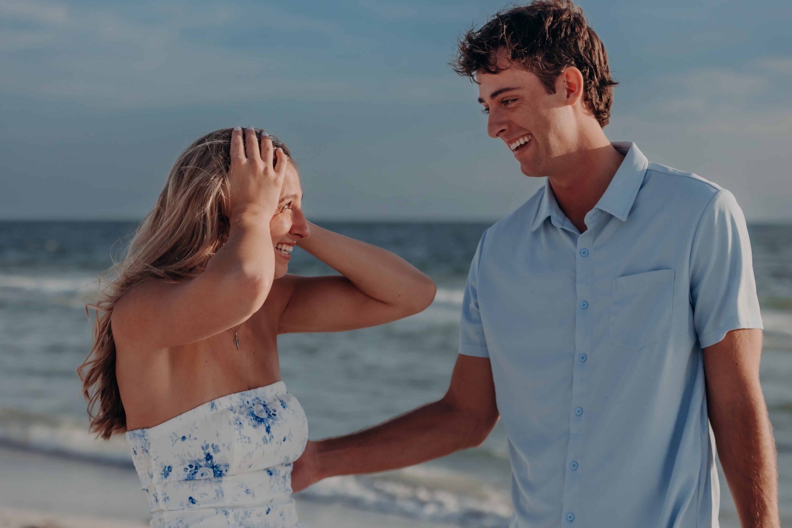 Quinten and Suzanna sharing a playful moment after their Lido Beach proposal