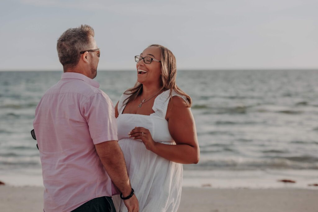 siesta key beach proposal admiring engagement ring sarasota