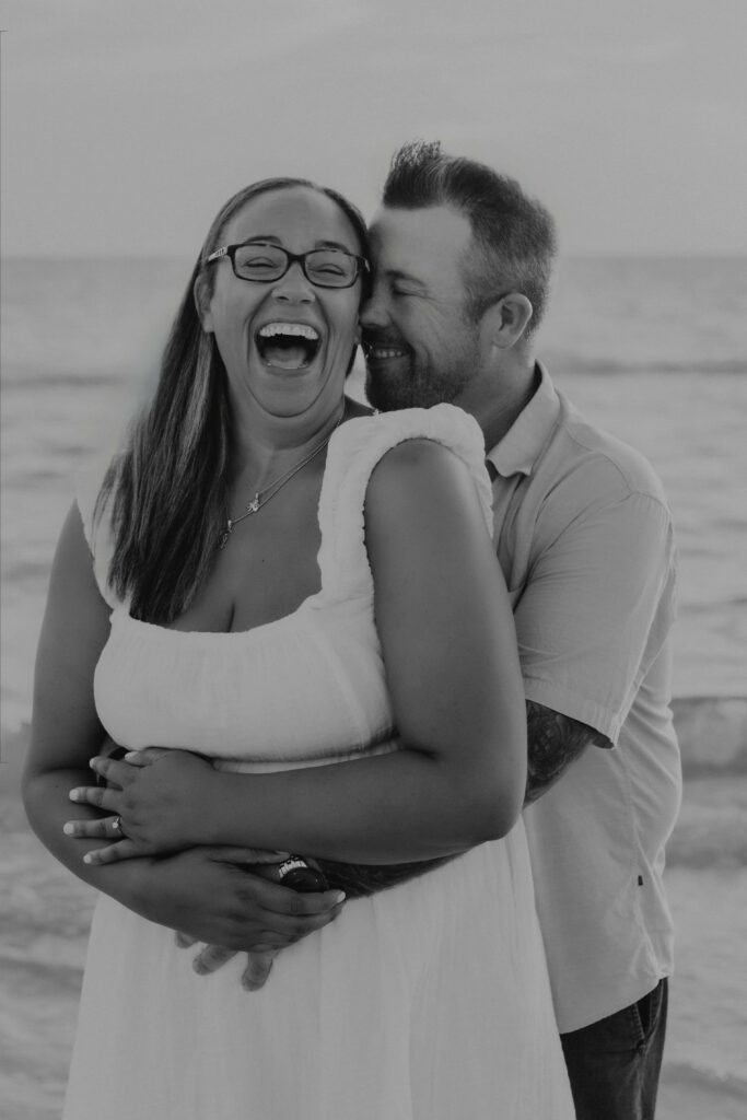 siesta key beach proposal couple black and white joyful embrace sarasota