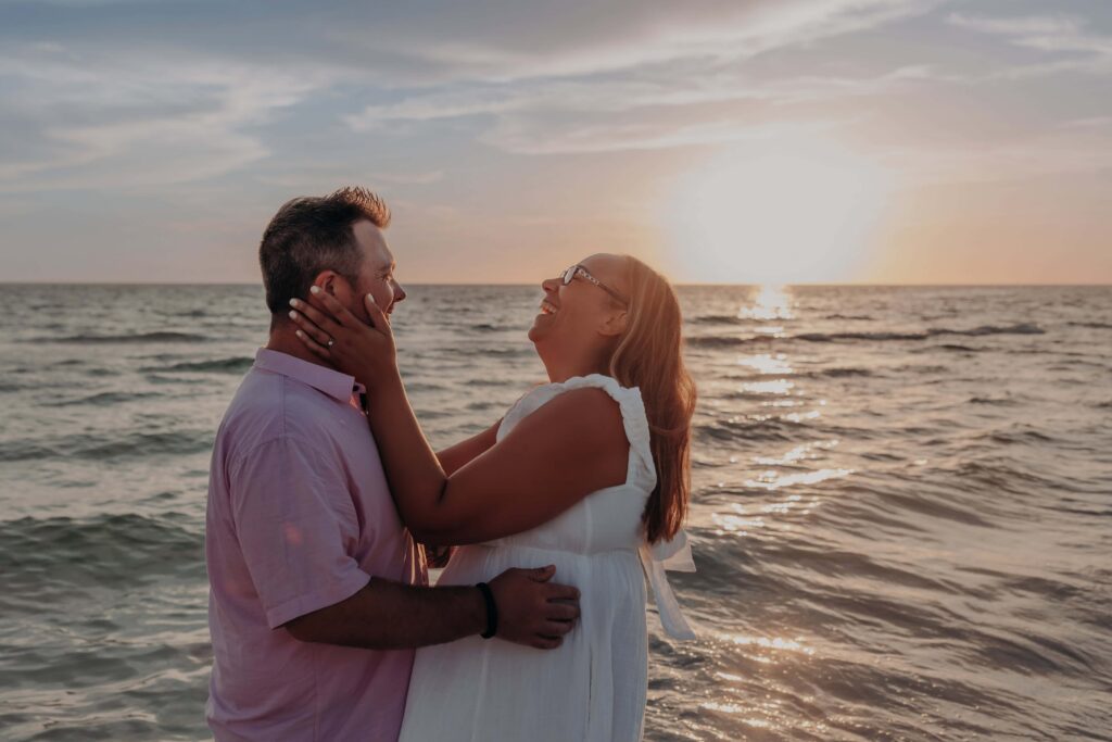 siesta key beach proposal couple forehead to forehead sunset sarasota