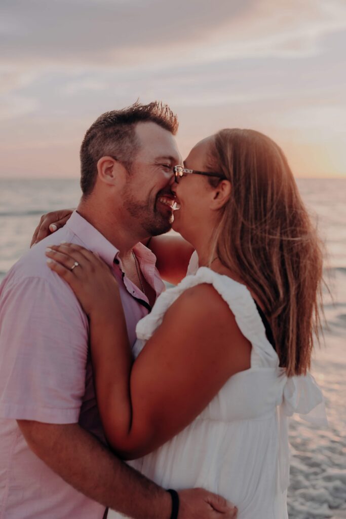 siesta key beach proposal couple laughing about to kiss ring visible sarasota