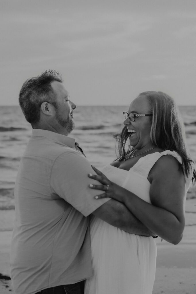 siesta key beach proposal couple laughing black and white portrait sarasota