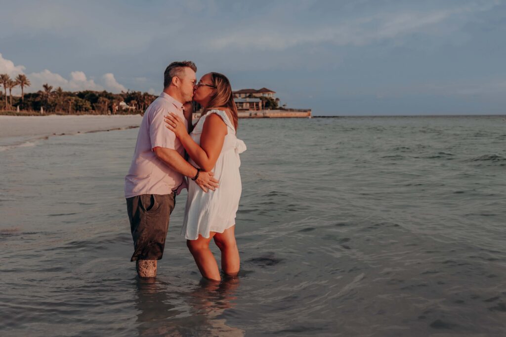 siesta key beach proposal couple playful leg kick sunset sarasota