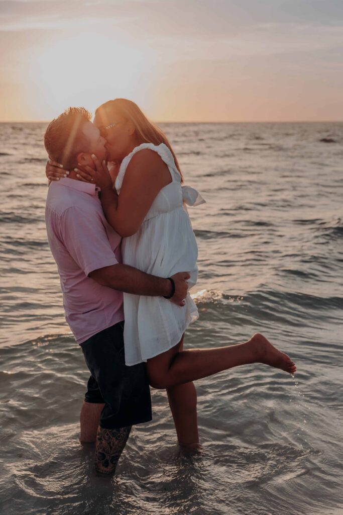 siesta key beach proposal couple silhouette kiss sunset sarasota