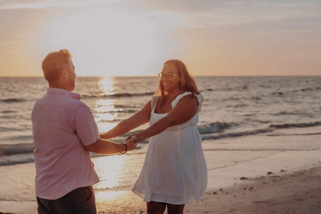 siesta key beach proposal couple spinning dancing sunset sarasota