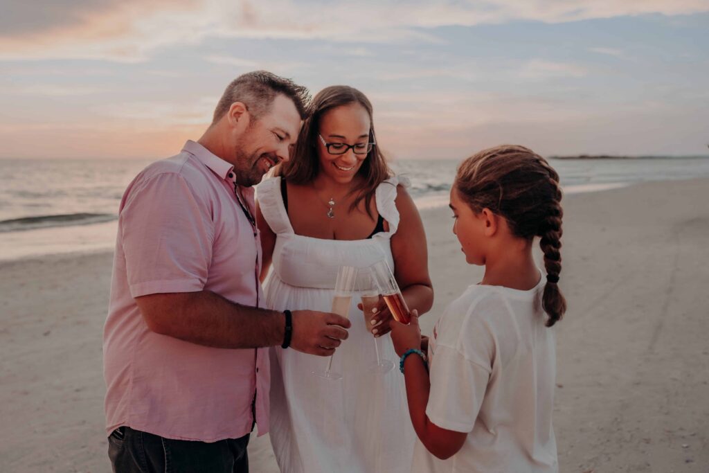 siesta key beach proposal family champagne toast with daughter sarasota