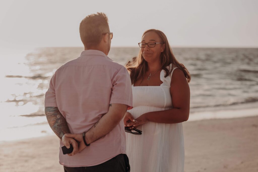 siesta key beach proposal fun candid playful couple sarasota