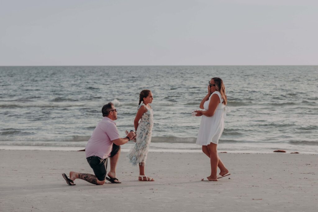 siesta key beach proposal photographer sarasota tom on one knee