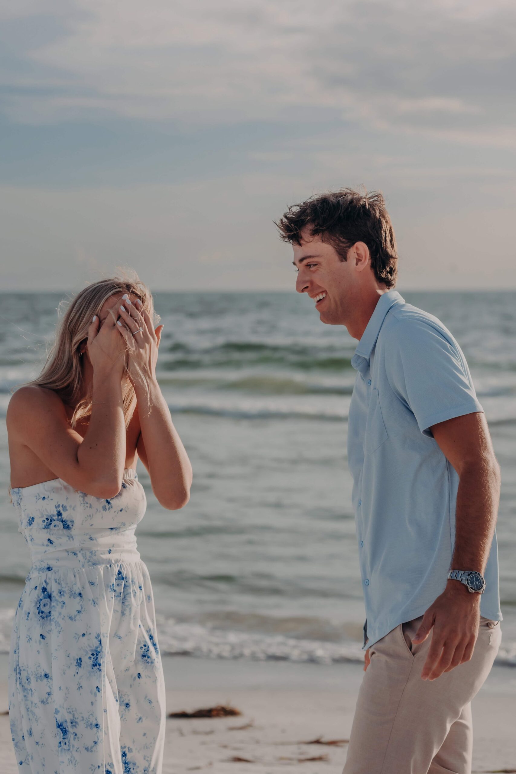 Suzanna covering her face in an emotional reaction on Lido Beach, Sarasota
