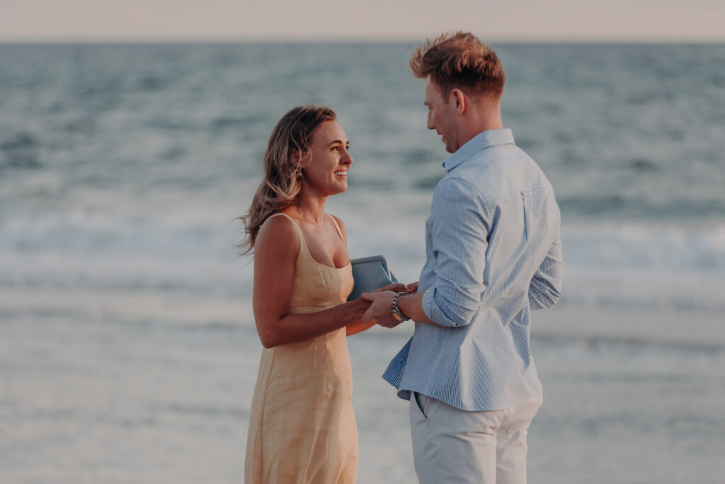 Michael and Regan share a kiss on the beach at sunset, Longboat Key, FL