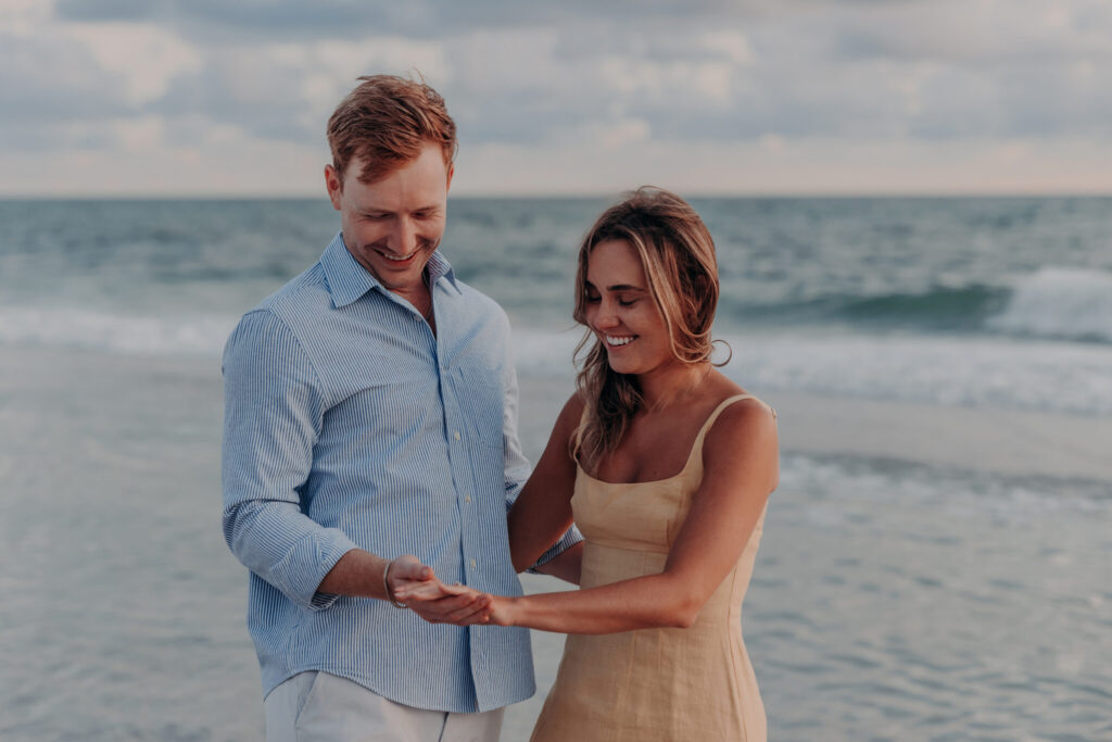 Michael and Regan share a kiss on the beach at sunset, Longboat Key, FL