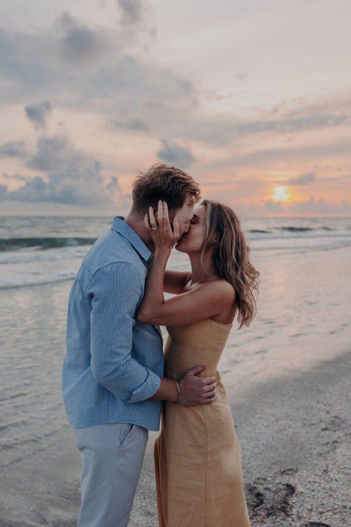 Black and white portrait of Michael and Regan embracing on the beach