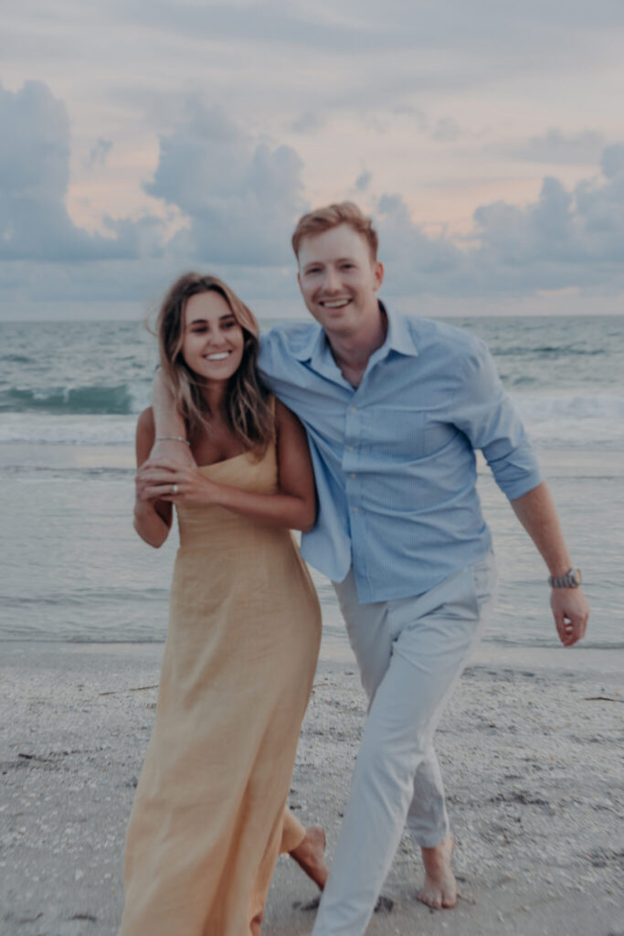Michael and Regan smiling together after getting engaged at Zota Beach Resort