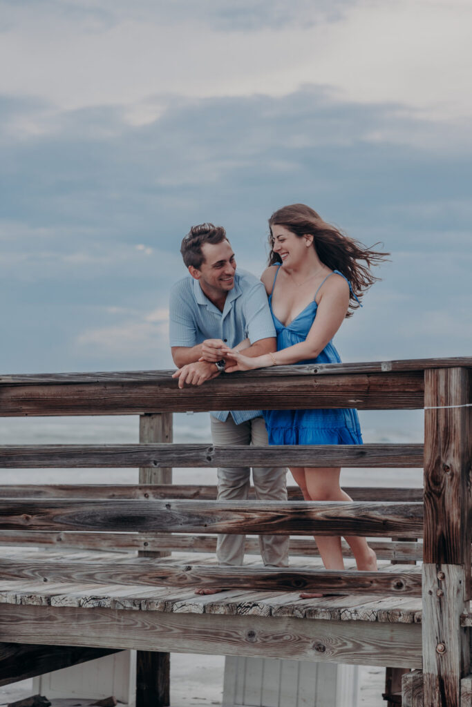 Ryan and Olivia embracing on the beach after the proposal (49)