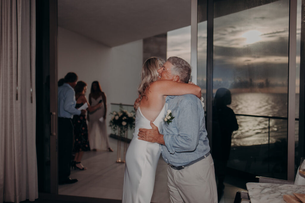 Allison and Jerry embracing on the balcony at St. Regis Longboat Key (29)